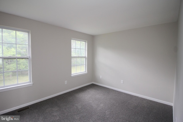 7 E Edgewater Ct, Sicklerville, NJ 08081 - empty room with healthy amount of natural light, baseboards, and dark colored carpet