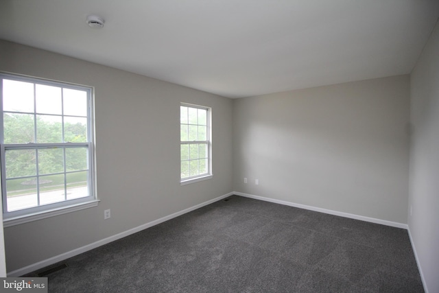 7 E Edgewater Ct, Sicklerville, NJ 08081 - empty room with a smoke detector, dark colored carpet, and baseboards