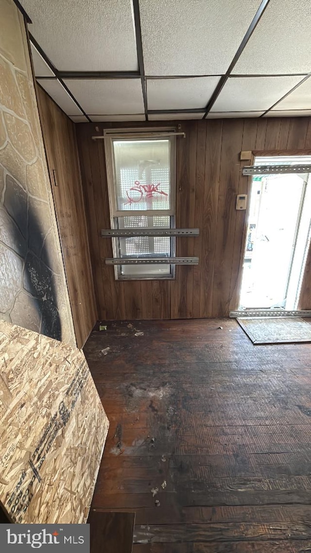 1902 Ramsay St, Baltimore, MD 21223 - unfurnished dining area with wood walls and hardwood / wood-style flooring