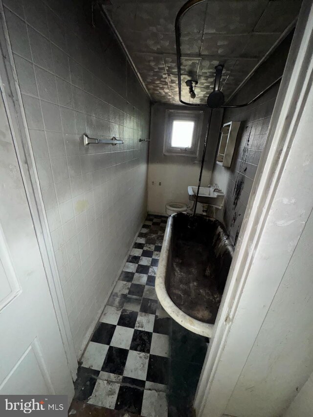 1902 Ramsay St, Baltimore, MD 21223 - below grade area featuring tile patterned floors
