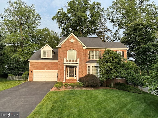 2405 N Park Ct, Dunn Loring, VA 22027 - colonial home featuring brick siding, asphalt driveway, and a garage