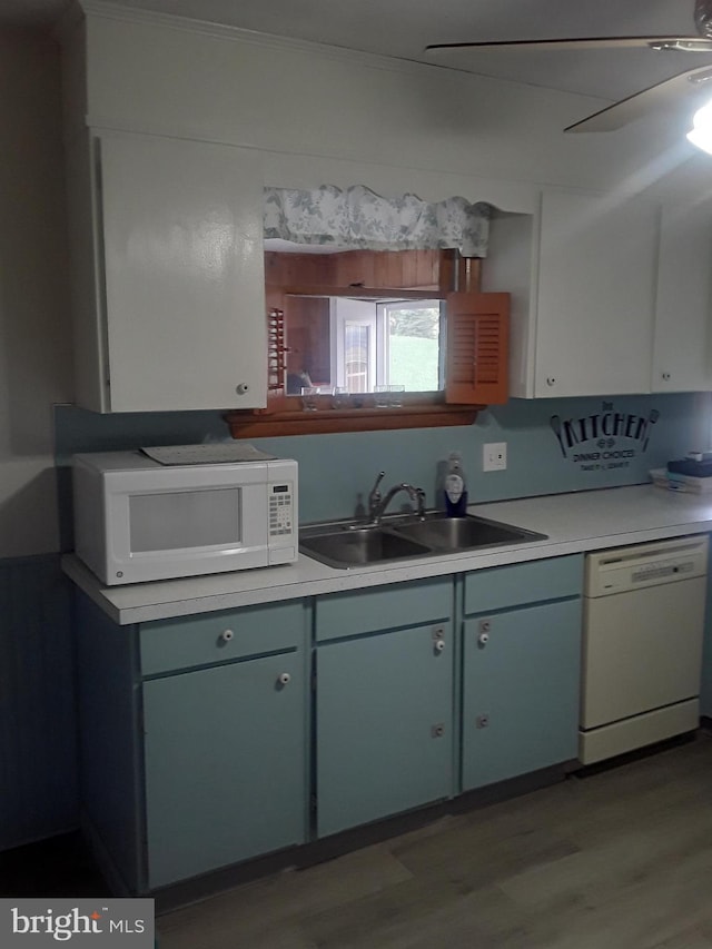 28 Kough Rd, Newville, PA 17241 - kitchen with white appliances, a sink, wood finished floors, light countertops, and crown molding