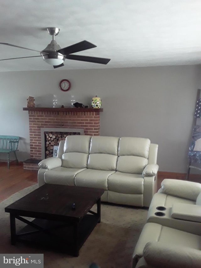 28 Kough Rd, Newville, PA 17241 - living area with a ceiling fan, a brick fireplace, wood finished floors, and baseboards