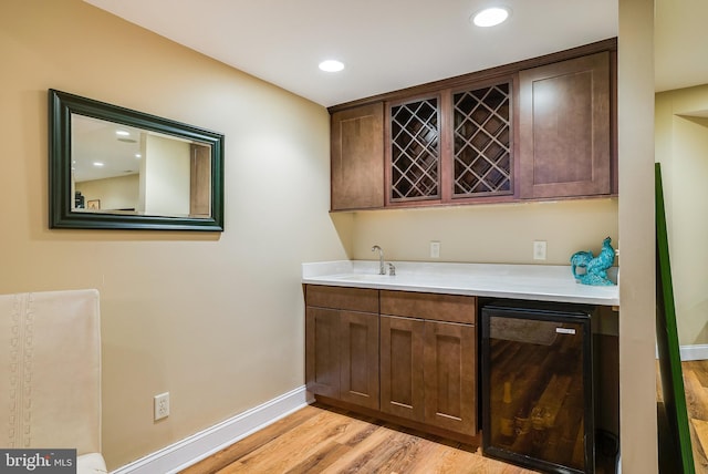 3525 Traveler Rd, Rockingham, VA 22801 - indoor wet bar with light wood-type flooring, recessed lighting, and beverage cooler
