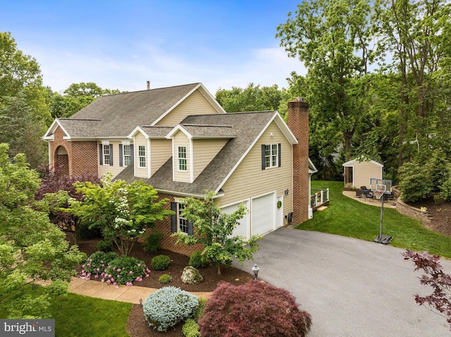 3525 Traveler Rd, Rockingham, VA 22801 - view of front of property featuring an attached garage, asphalt driveway, roof with shingles, a chimney, and brick siding