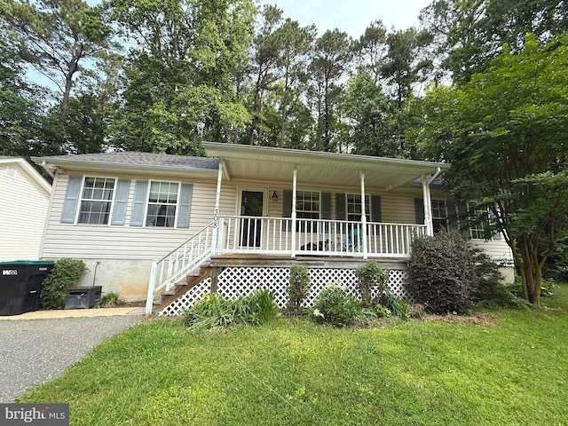 308 Chestnut Dr, Lusby, MD 20657 - single story home featuring a porch, a front lawn, and stairs