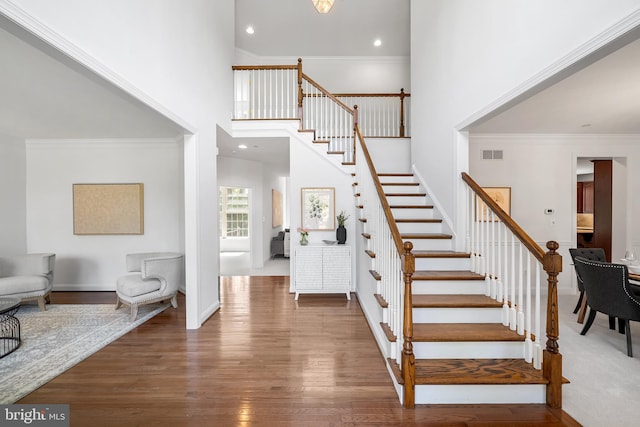 106 Gabrielle Ct Unit 8, Broomall, PA 19008 - staircase with wood finished floors, a towering ceiling, recessed lighting, and ornamental molding