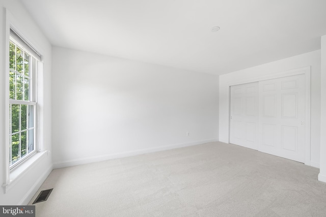 106 Gabrielle Ct Unit 8, Broomall, PA 19008 - unfurnished bedroom featuring light colored carpet, multiple windows, and baseboards