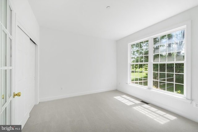 106 Gabrielle Ct Unit 8, Broomall, PA 19008 - unfurnished bedroom with light colored carpet, baseboards, and a closet