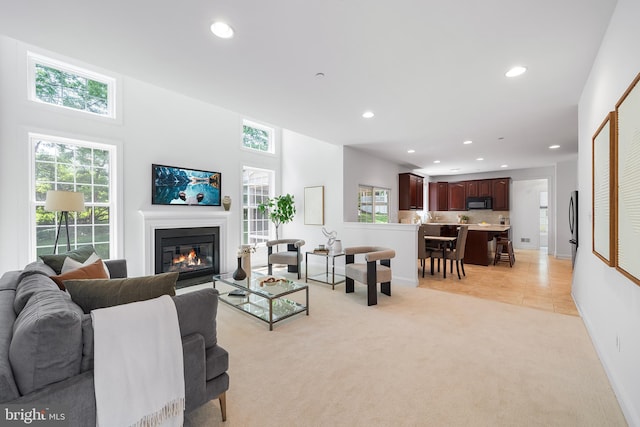 106 Gabrielle Ct Unit 8, Broomall, PA 19008 - living room featuring light carpet, recessed lighting, healthy amount of natural light, a glass covered fireplace, and baseboards