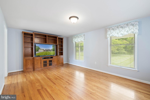 233 Kimble Rd, Berryville, VA 22611 - unfurnished living room with light wood-style floors and baseboards
