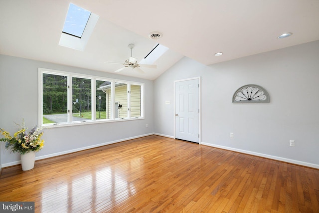 233 Kimble Rd, Berryville, VA 22611 - unfurnished room featuring a skylight, lofted ceiling, light wood finished floors, a ceiling fan, and recessed lighting