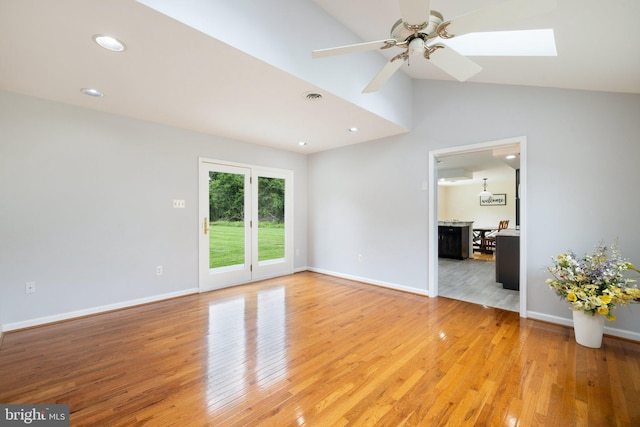 233 Kimble Rd, Berryville, VA 22611 - unfurnished room with light wood-style flooring, a ceiling fan, a skylight, recessed lighting, and high vaulted ceiling