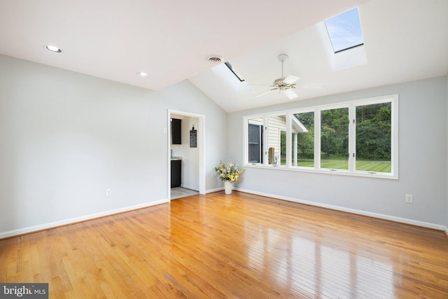 233 Kimble Rd, Berryville, VA 22611 - unfurnished living room featuring a skylight, lofted ceiling, light wood-type flooring, a ceiling fan, and recessed lighting