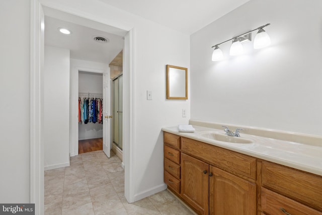 233 Kimble Rd, Berryville, VA 22611 - bathroom with a stall shower, a walk in closet, vanity, and tile patterned flooring
