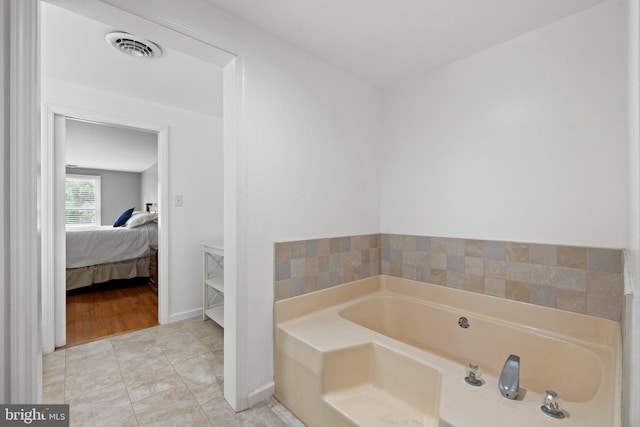 233 Kimble Rd, Berryville, VA 22611 - full bathroom featuring a garden tub, ensuite bathroom, and tile patterned floors