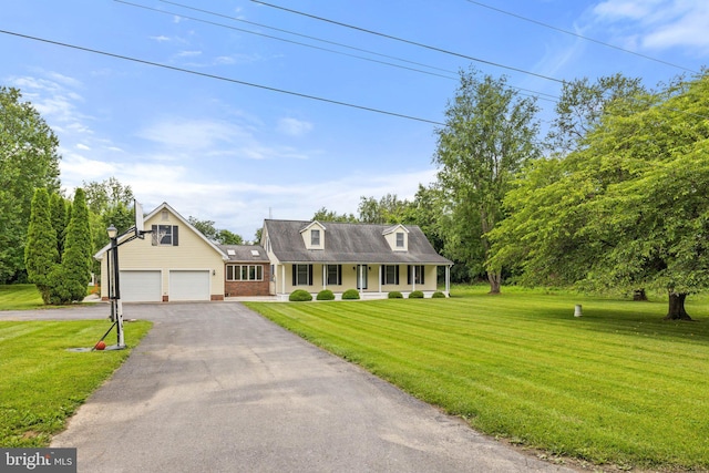 233 Kimble Rd, Berryville, VA 22611 - cape cod house featuring covered porch, brick siding, driveway, a front lawn, and a garage