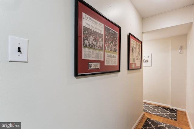 9039 Sligo Creek Pkwy Unit 102, Silver Spring, MD 20901 - hallway with baseboards and wood finished floors