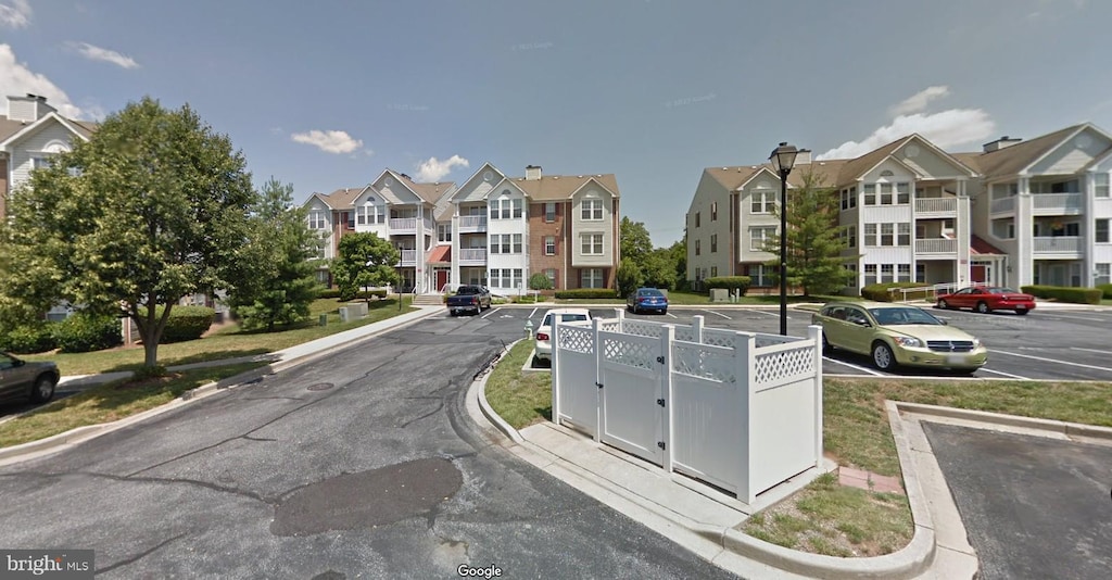 903 Blue Leaf Ct Unit 63A, Frederick, MD 21701 - view of asphalt road with curbs, sidewalks, and street lighting
