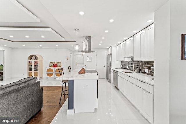 6101 Edsall Rd Unit 1111, Alexandria, VA 22304 - kitchen featuring island range hood, appliances with stainless steel finishes, a sink, recessed lighting, and white cabinetry