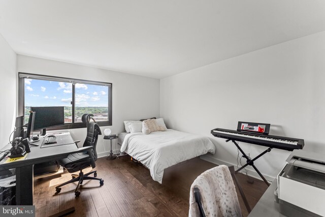 6101 Edsall Rd Unit 1111, Alexandria, VA 22304 - bedroom with wood finished floors, a desk, and baseboards