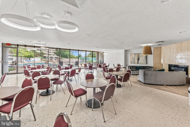 6101 Edsall Rd Unit 1111, Alexandria, VA 22304 - dining space with floor to ceiling windows and a textured ceiling