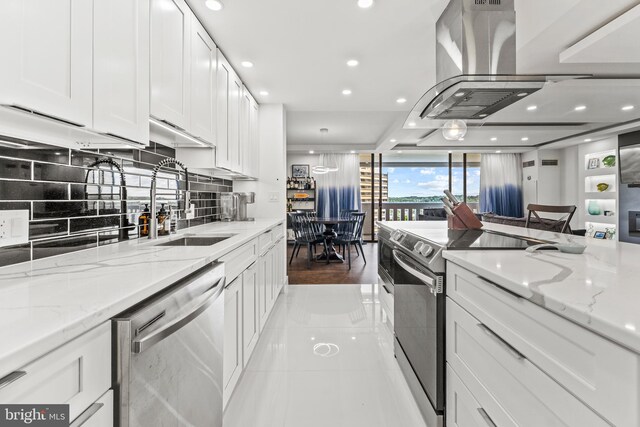6101 Edsall Rd Unit 1111, Alexandria, VA 22304 - kitchen with stainless steel appliances, a sink, recessed lighting, white cabinets, and tasteful backsplash