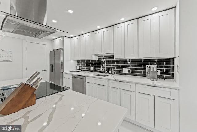 6101 Edsall Rd Unit 1111, Alexandria, VA 22304 - kitchen featuring a sink, stainless steel appliances, white cabinetry, island exhaust hood, and backsplash