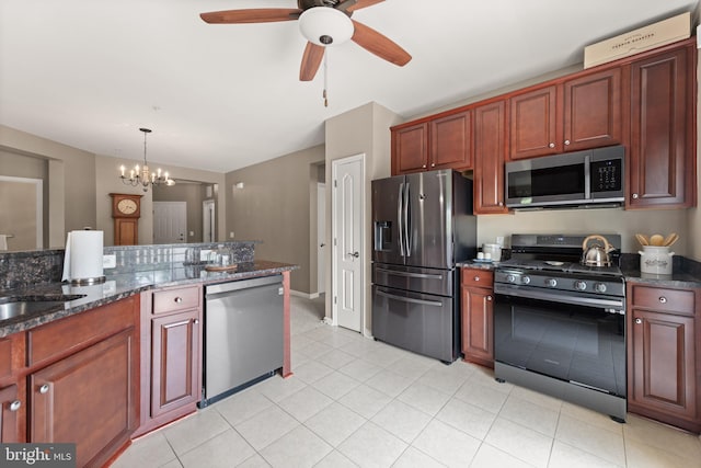 1412 Wigeon Way Unit 204, Gambrills, MD 21054 - kitchen with appliances with stainless steel finishes, ceiling fan, decorative light fixtures, a chandelier, and dark stone counters
