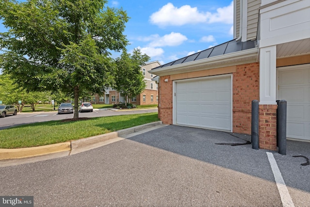 1412 Wigeon Way Unit 204, Gambrills, MD 21054 - garage featuring asphalt driveway
