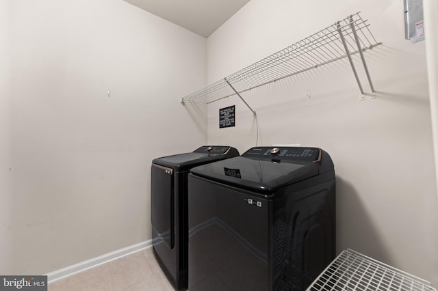 1412 Wigeon Way Unit 204, Gambrills, MD 21054 - laundry room featuring washer and dryer and light tile patterned floors