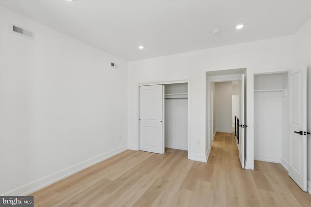 1910 E Atlantic St, Philadelphia, PA 19134 - unfurnished bedroom featuring two closets, light wood-style floors, recessed lighting, and baseboards