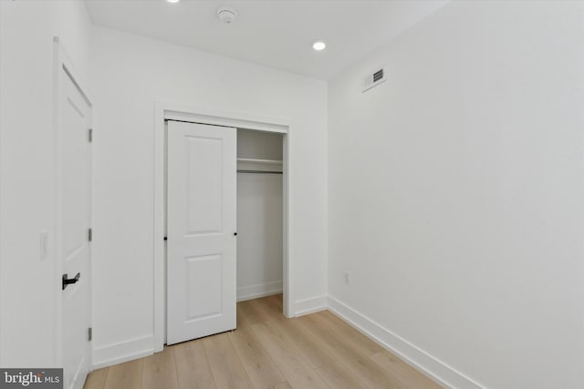 1910 E Atlantic St, Philadelphia, PA 19134 - unfurnished bedroom with light wood-style floors, baseboards, recessed lighting, and a closet