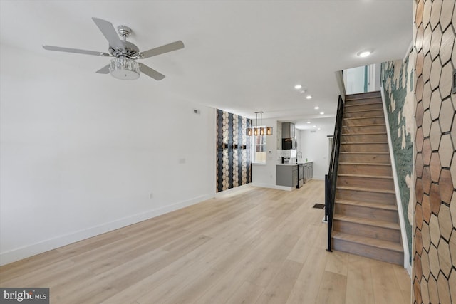 1910 E Atlantic St, Philadelphia, PA 19134 - unfurnished living room with stairway, baseboards, recessed lighting, light wood finished floors, and ceiling fan