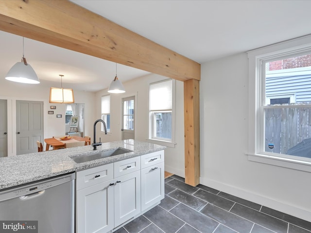 142 E New St, Lancaster, PA 17602 - kitchen featuring dishwasher, a sink, white cabinets, decorative light fixtures, and light stone counters