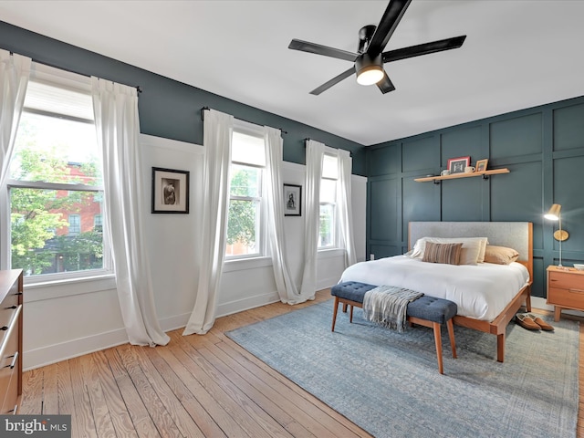 142 E New St, Lancaster, PA 17602 - bedroom with light wood-style floors, baseboards, a decorative wall, and ceiling fan