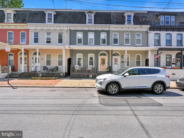 142 E New St, Lancaster, PA 17602 - view of property with mansard roof and covered porch