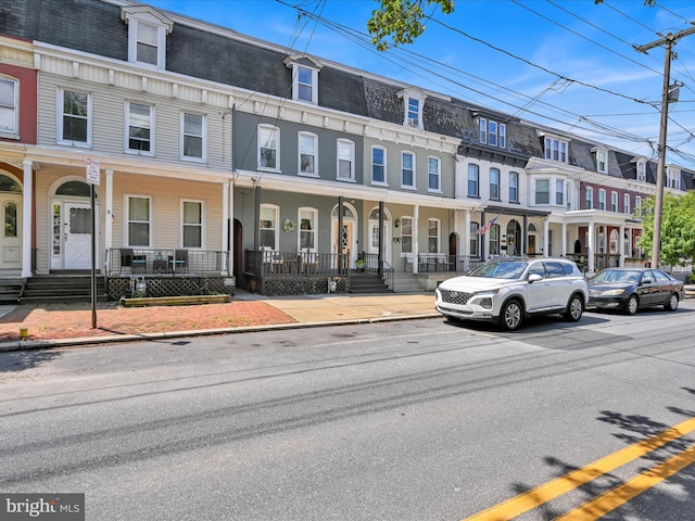 142 E New St, Lancaster, PA 17602 - view of front of home featuring mansard roof and a porch