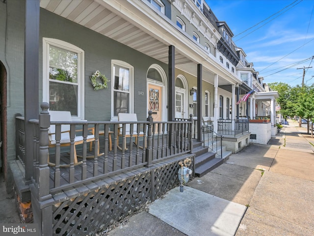 142 E New St, Lancaster, PA 17602 - view of exterior entry with covered porch and brick siding