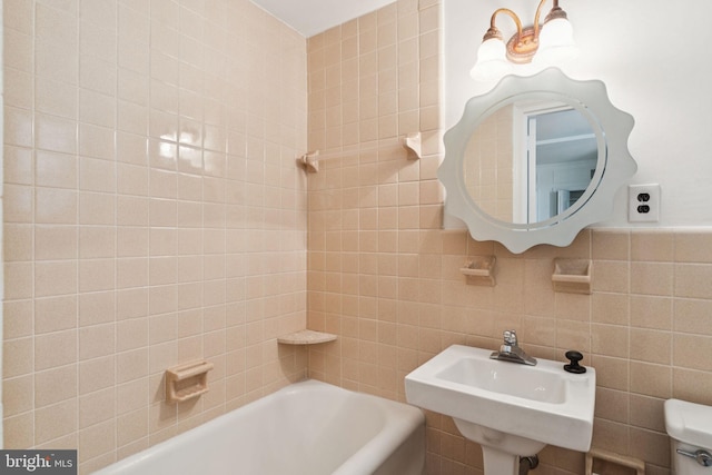 1901 Walnut St Unit 16E, Philadelphia, PA 19103 - bathroom featuring a sink, tile walls, and toilet