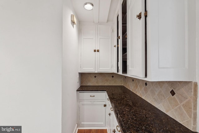 1901 Walnut St Unit 16E, Philadelphia, PA 19103 - kitchen with white cabinetry, tasteful backsplash, and dark stone countertops