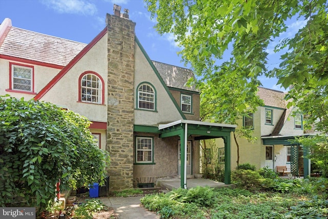 340 W Durham St, Philadelphia, PA 19119 - rear view of property with stucco siding and a chimney