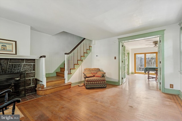 340 W Durham St, Philadelphia, PA 19119 - living area featuring wood finished floors, stairs, a ceiling fan, baseboards, and a fireplace