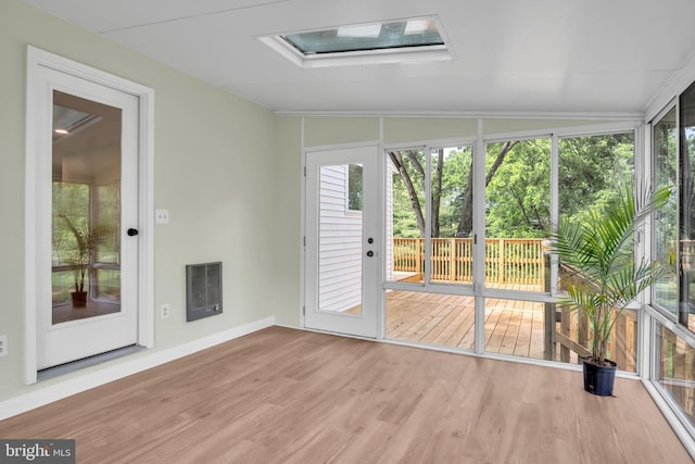 318 Mayfield Ct, Westminster, MD 21158 - unfurnished sunroom with wood finished floors, a wooden deck, a skylight, heating unit, and baseboards