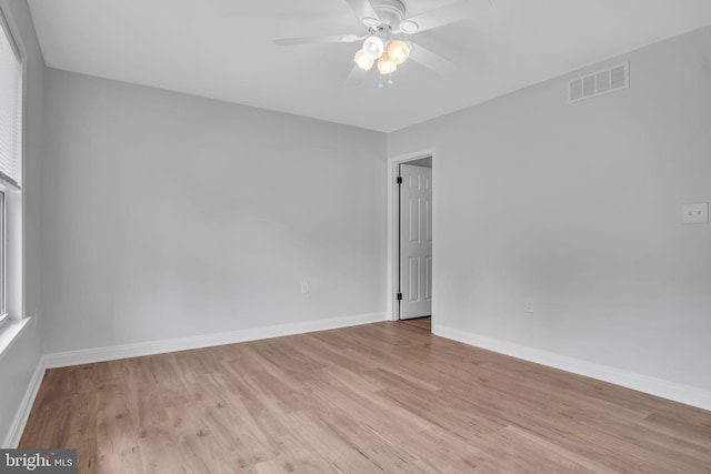 318 Mayfield Ct, Westminster, MD 21158 - unfurnished room featuring light wood finished floors, a ceiling fan, baseboards, and plenty of natural light