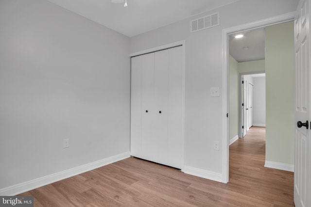 318 Mayfield Ct, Westminster, MD 21158 - unfurnished bedroom featuring light wood-style flooring, baseboards, and a closet