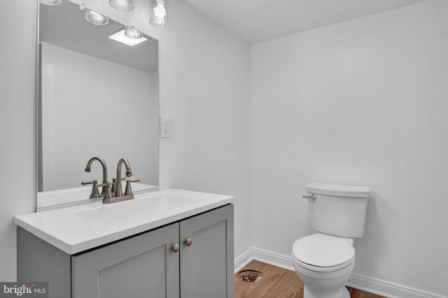 318 Mayfield Ct, Westminster, MD 21158 - half bath featuring wood finished floors, vanity, toilet, and baseboards