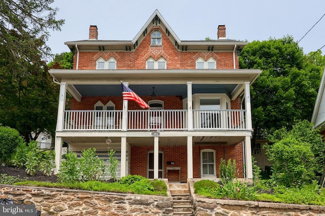 143 Hanover St, Glen Rock, PA 17327 - view of front of property with a balcony, a chimney, a porch, and brick siding