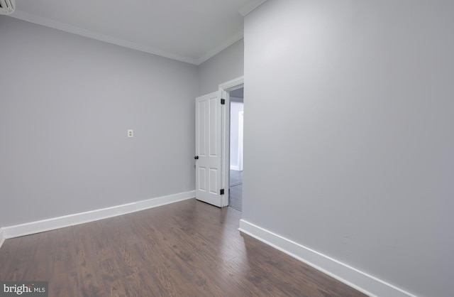 143 Hanover St, Glen Rock, PA 17327 - unfurnished room with crown molding, dark wood finished floors, and baseboards
