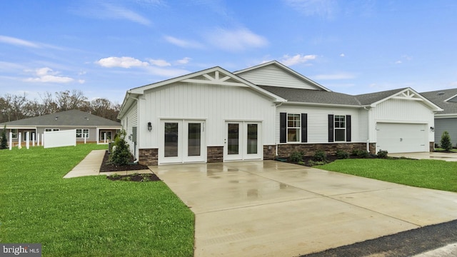 7 Florence Sarah Ln, Lexington City, VA 24450 - view of front of home with driveway, stone siding, a front yard, and french doors